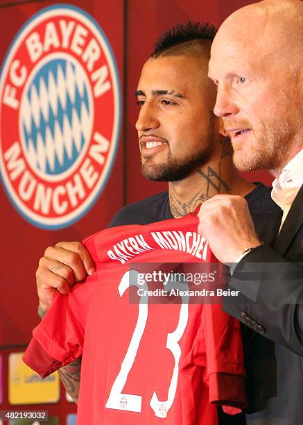 Chilean midfielder Arturo Vidal signs his contract with FC Bayern Munich on July 28, 2015 in Munich, Germany.