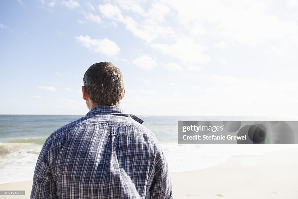 Man looking out to sea, Satellite Beach, Florida, US