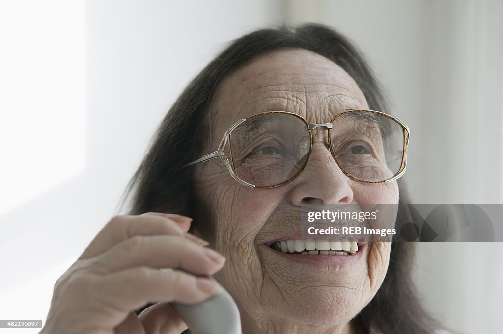 Senior woman wearing glasses on the phone