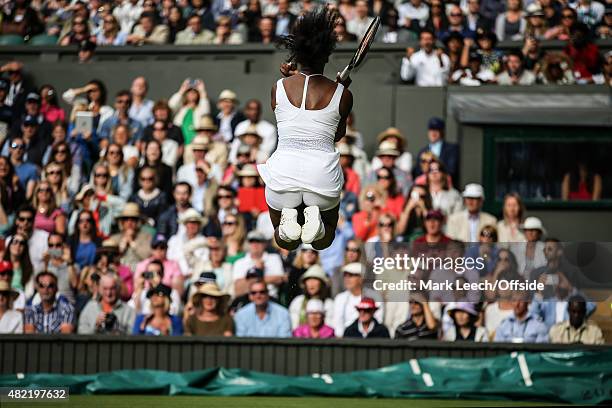 Serena Williams celebrates victory against Victoria Azarenka during their quarter final match on day eight of the Wimbledon Lawn Tennis Championships...