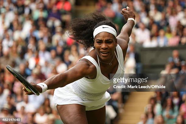 Serena Williams in action against Victoria Azarenka during their quarter final match on day eight of the Wimbledon Lawn Tennis Championships at the...