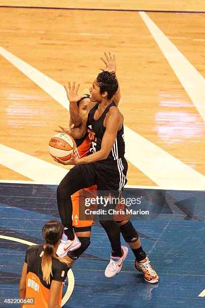 Angel McCoughtry of the Eastern Conference All Stars drives to the basket against the Western Conference All Stars during the Boost Mobile WNBA...