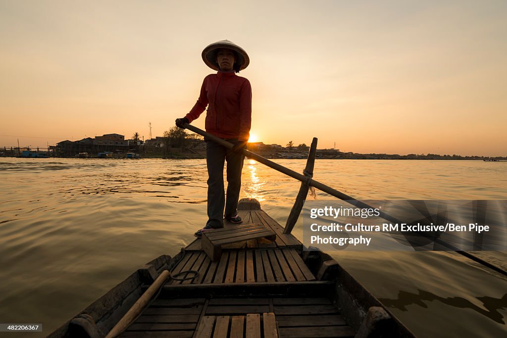 Woman on boat on Tonle Sap river, Phoum Kandal, Kompong Chnang, Cambodia