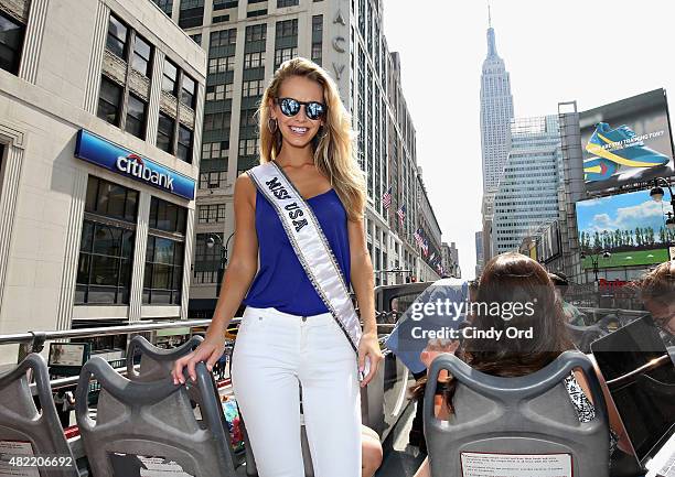 Miss USA 2015 Olivia Jordan takes a ride on the Gray Line CitySightseeing NYC bus on July 28, 2015 in New York City.