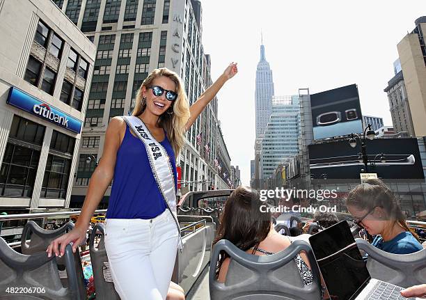 Miss USA 2015 Olivia Jordan takes a ride on the Gray Line CitySightseeing NYC bus on July 28, 2015 in New York City.