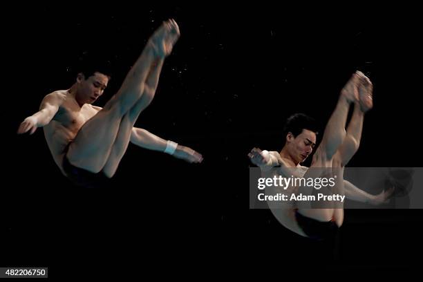 Yuan Cao and Kai Qin of China compete in the Men's 3m Springboard Synchronised Diving Final on day four of the 16th FINA World Championships at the...