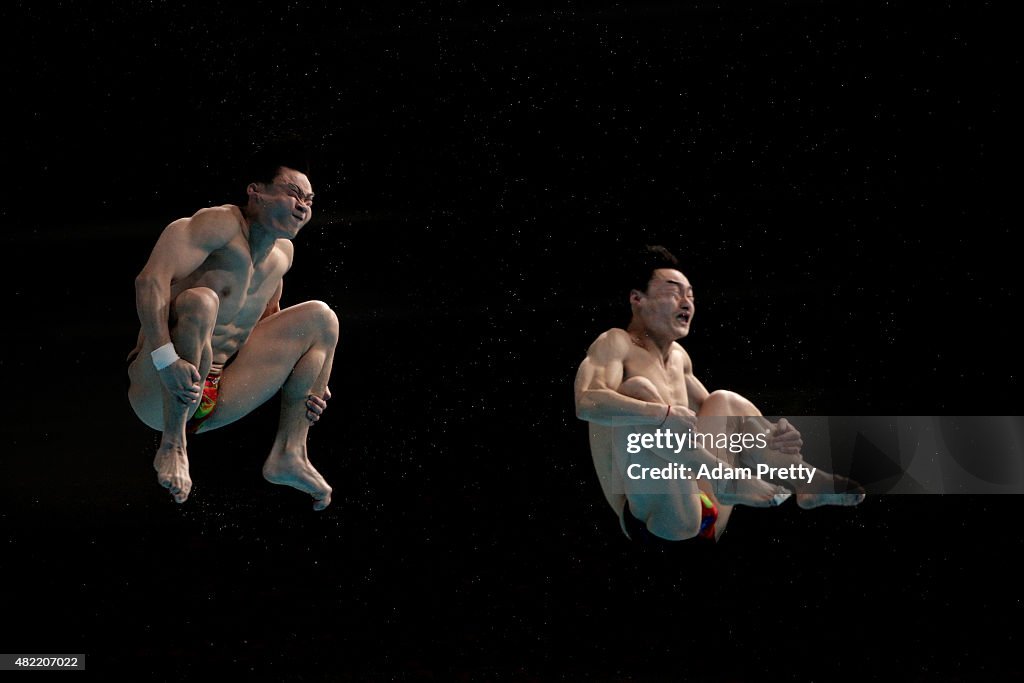 Yuan Cao and Kai Qin of China compete in the Men's 3m Springboard