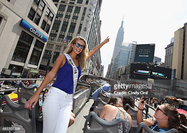 Miss USA 2015 Olivia Jordan takes a ride on the Gray Line CitySightseeing NYC bus on July 28, 2015 in New York City.