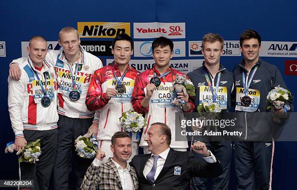 Silver medalists Evgenii Kuznetsov and Ilia Zakharov of Russia, gold medallists Yuan Cao and Kai Qin of China and bronze medalists Jack Laugher and...