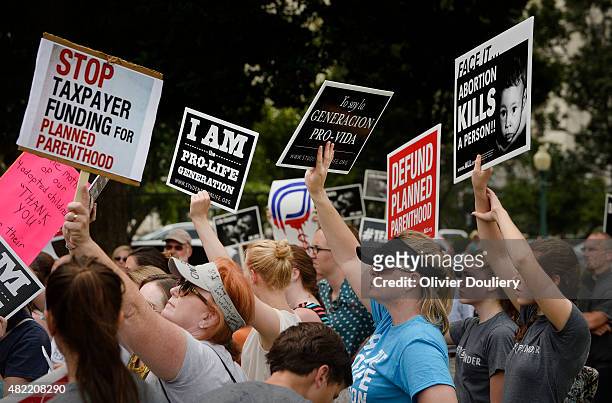 Anti-abortion activists hold a rally opposing federal funding for Planned Parenthood in front of the U.S. Capitol on July 28, 2015 in Washington, DC....