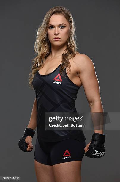 Women's bantamweight champion Ronda Rousey poses for a portrait during a UFC photo session at the Sheraton Rio Hotel on July 28, 2015 in Rio de...
