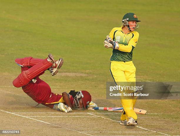 Stafanie Taylor of the West Indies dives but is run out by Alyssa Healy of Australia during the ICC Women's World Twenty20 Bangladesh 2014 1st...