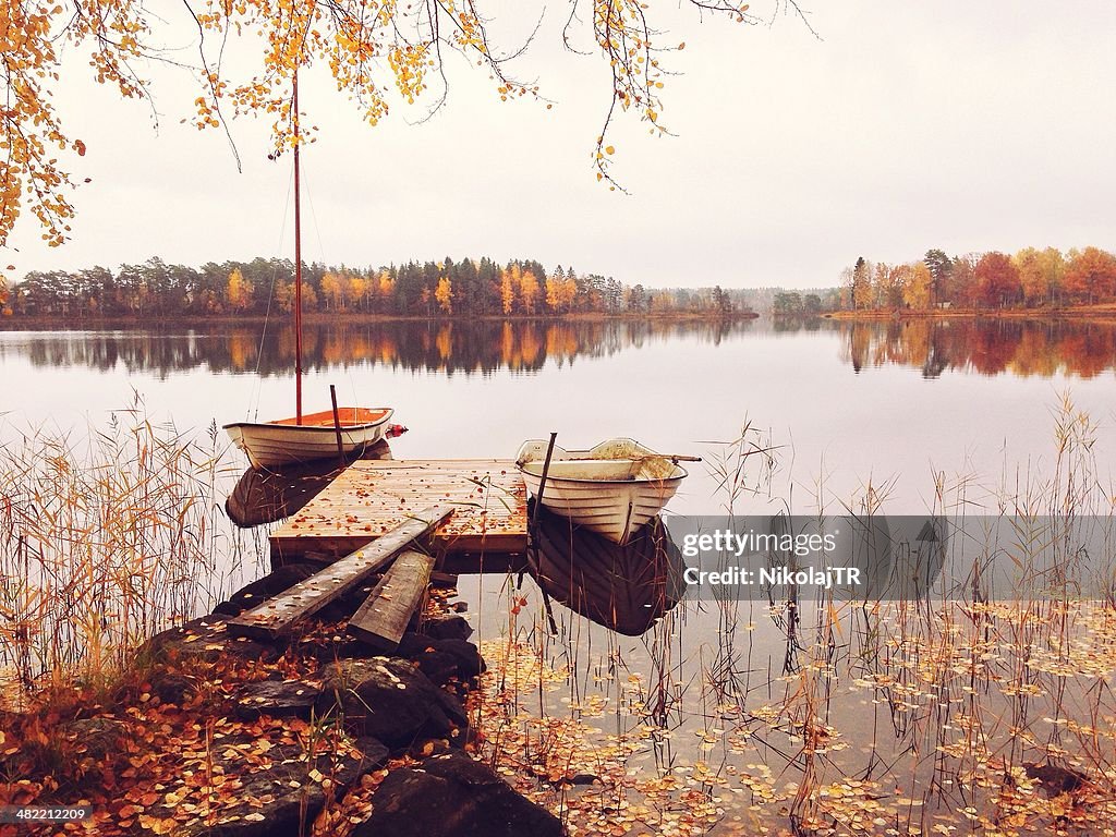 Sweden, Boats at tranquil lake