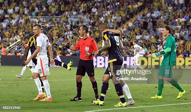 Fernandao of Fenerbahce argues with Vyacheslav Shevchuk of Shaktar Donetsk during UEFA Champions League Third Qualifying Round 1st Leg match betweeen...