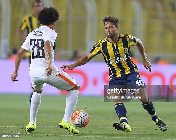 Sousa of Fenerbahce is in action with Taison of Shaktar Donetsk during UEFA Champions League Third Qualifying Round 1st Leg match betweeen Fenerbahce...