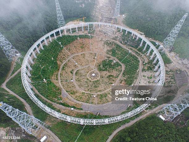 The assembly site of the single-aperture spherical telescope "FAST" seen on July 28, 2015 in Pingtang, China. Assembly of the telescope, with a dish...