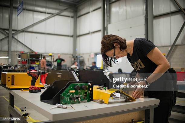 An engineer hand assembles the Husky robot at the Clearpath Robotics Inc. Facility in Kitchener, Ontario, Canada, on Friday, July 24, 2015. Clearpath...