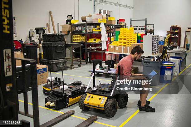 An engineer works with the Husky, Kingfisher, and Jackal robots at the Clearpath Robotics Inc. Facility in Kitchener, Ontario, Canada, on Friday,...