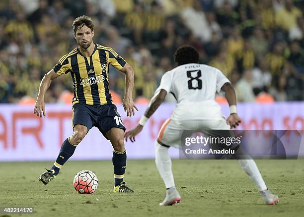 Diego Ribas of Fenerbahce vies with Fred of Shakhtar Donetsk during UEFA Champions League Third Qualifying Round 1st Leg match between Fenerbahce and...