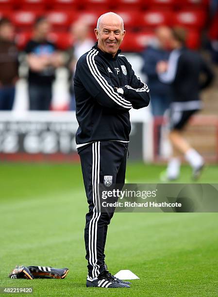 West Brom manager Tony Pulis takes the warm up before the Pre-Season Friendly between Walsall and West Bromwich Albion at Banks' Stadium on July 28,...