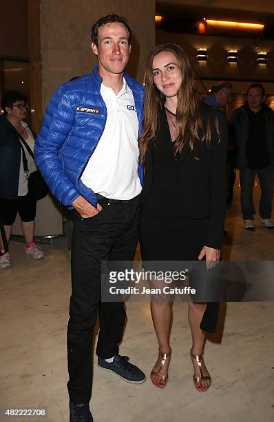 Alexandre Geniez of France and Team FDJ and his girlfriend leave their hotel for the team's party, following stage twenty one of the 2015 Tour de...