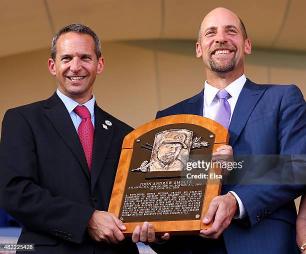 Hall of Fame President Jeff Idelson presents to John Smoltz his Hall of Fame Plaque during the Induction Ceremony at National Baseball Hall of Fame...