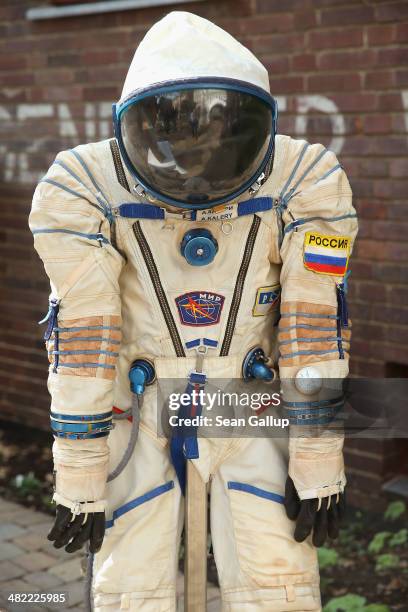 Sokol KV2 spacesuit hangs on display during a press preview of the Vozvrashchayemyi Apparat former Soviet space capsule before its auction on April...