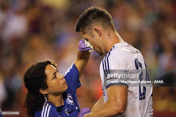 Chelsea first-team doctor Eva Carneiro attends to Gary Cahill of Chelsea who suffered a bloody nose following scoring the goal which tied the game...