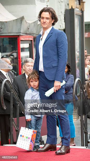 Actor Orlando Bloom and son Flynn Christopher Blanchard Copeland Bloom at The Hollywood Walk Of Fame ceremony honoring Orlando Bloom on April 2, 2014...