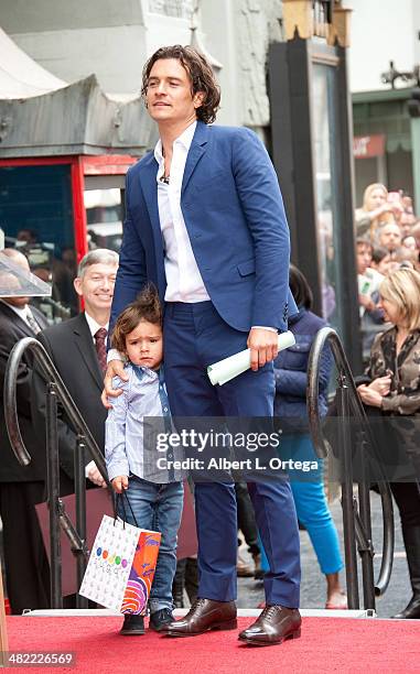 Actor Orlando Bloom and son Flynn Christopher Blanchard Copeland Bloom at The Hollywood Walk Of Fame ceremony honoring Orlando Bloom on April 2, 2014...