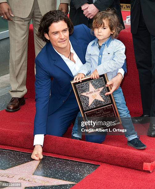 Actor Orlando Bloom and son Flynn Christopher Blanchard Copeland Bloom at The Hollywood Walk Of Fame ceremony honoring Orlando Bloom on April 2, 2014...