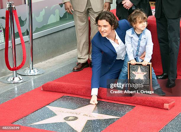 Actor Orlando Bloom and son Flynn Christopher Blanchard Copeland Bloom at The Hollywood Walk Of Fame ceremony honoring Orlando Bloom on April 2, 2014...