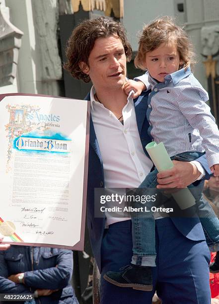 Actor Orlando Bloom and son Flynn Christopher Blanchard Copeland Bloom at The Hollywood Walk Of Fame ceremony honoring Orlando Bloom on April 2, 2014...