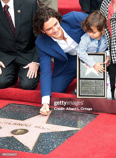 Actor Orlando Bloom and son Flynn Christopher Blanchard Copeland Bloom at The Hollywood Walk Of Fame ceremony honoring Orlando Bloom on April 2, 2014...