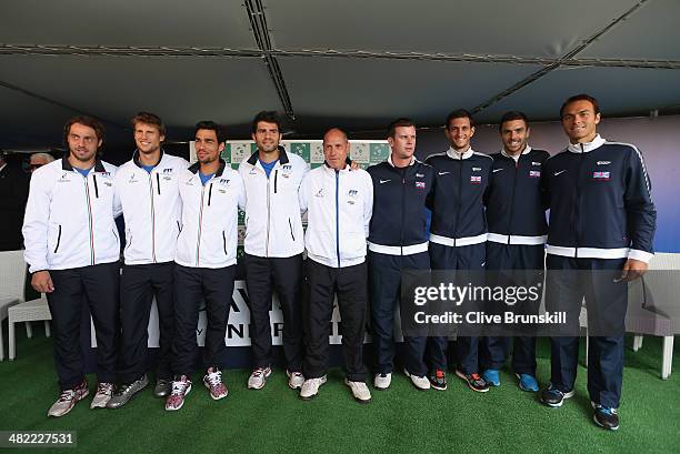 Paolo Lorenzi,Andreas Seppi,Fabio Fognini,Simone Bolelli and team captain Corrado Barazzutti of Italy and team captain Leon Smith,James Ward,Colin...