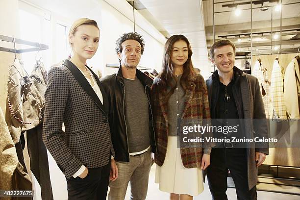 Salvatore Ficarra and Valentino Picone pose with models during the Lardini Boutique Opening on April 3, 2014 in Milan, Italy.
