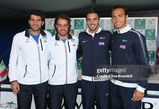 Simone Bolelli and Paolo Lorenzi of Italy pose for a photograph with Colin Fleming and Ross Hutchins of Great Britain prior to playing their doubles...