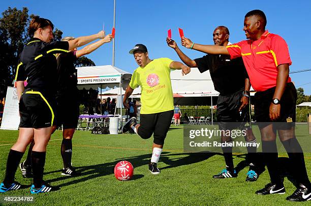 Starkey Hearing Foundation Ambassador Kyle Massey has fun with the referees as he participates in The Special Olympics Unified Sports Experience...