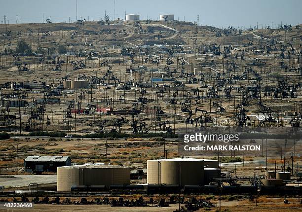General view shows oil pumping jacks and drilling pads at the Kern River Oil Field where the principle operator is the Chevron Corporation in...