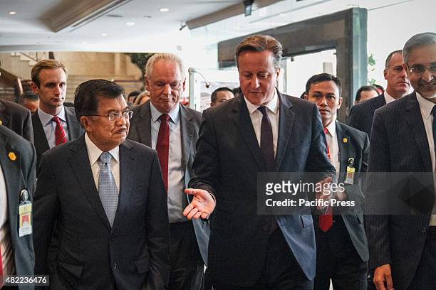 Indonesian Vice President Jusuf Kalla and British Prime Minister David Cameron leave the venue after the opening of the UK-Indonesia Business Forum...