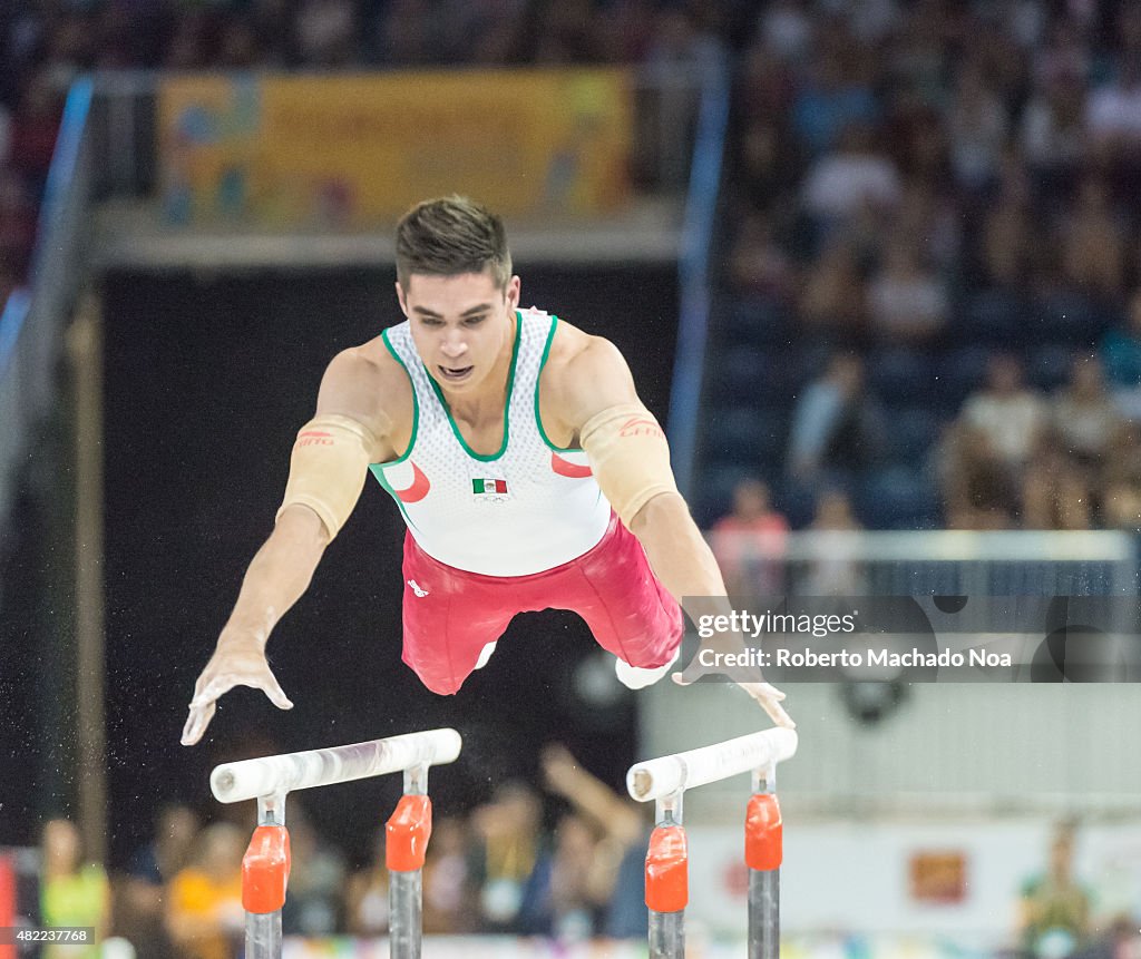 Daniel Corral Barron performs in the parallel bars during...