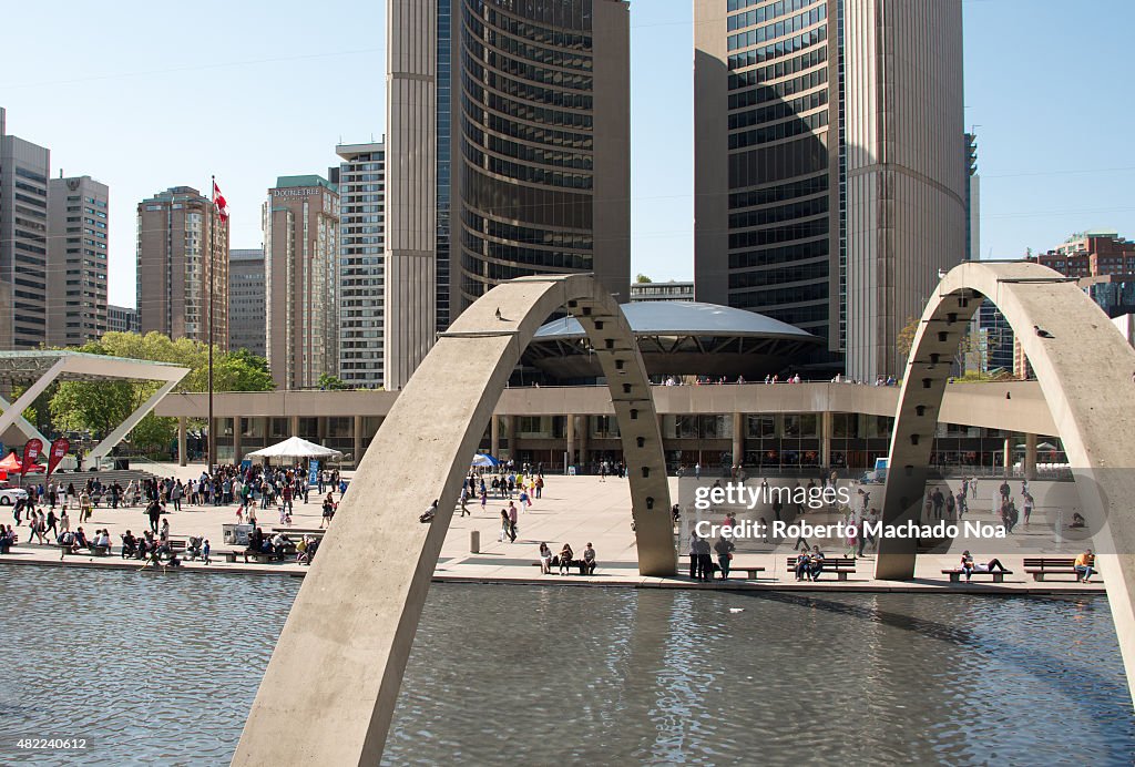 Arches over pool in Nathan Phillips Square, New city hall...