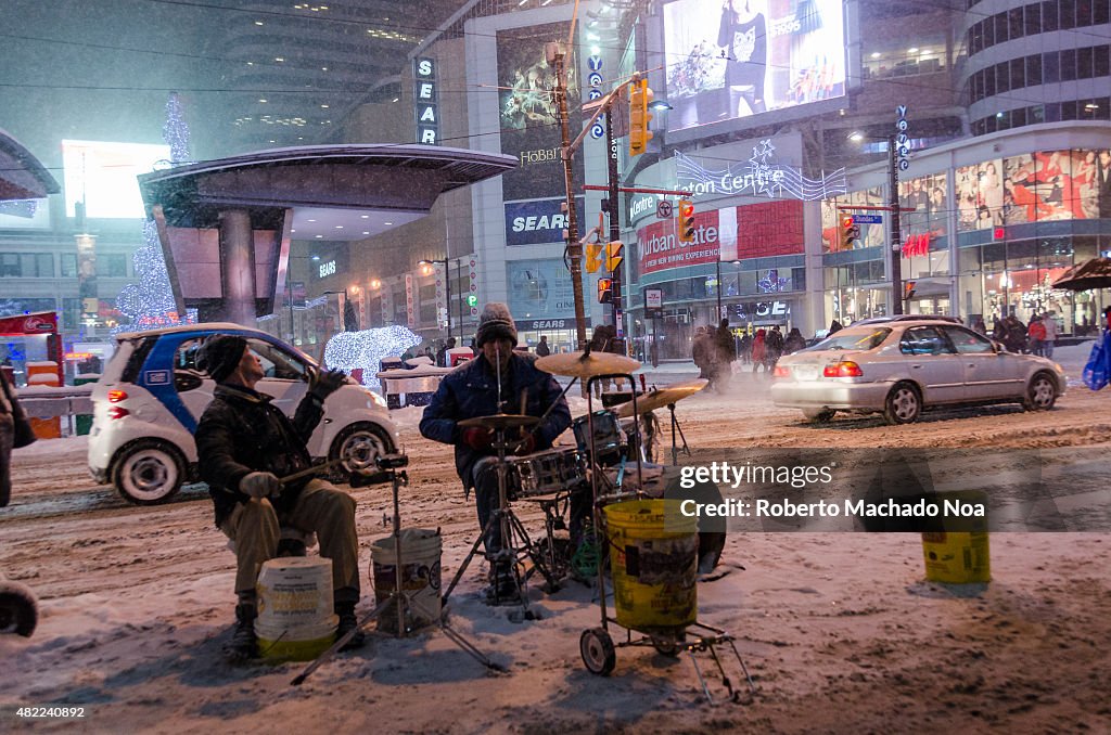 Dundas Square: Street musicians in during a snow storm in...