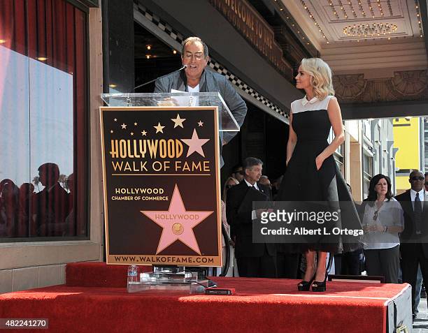 Director Kenny Ortega with actress Kristin Chenoweth at the Kristin Chenoweth Star ceremony held on The Hollywood Walk Of Fame on July 24, 2015 in...