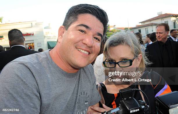 Gilbert Flores and Carrie Fisher at the Premiere Of Warner Bros. Pictures' "Vacation" held at Regency Village Theatre on July 27, 2015 in Westwood,...