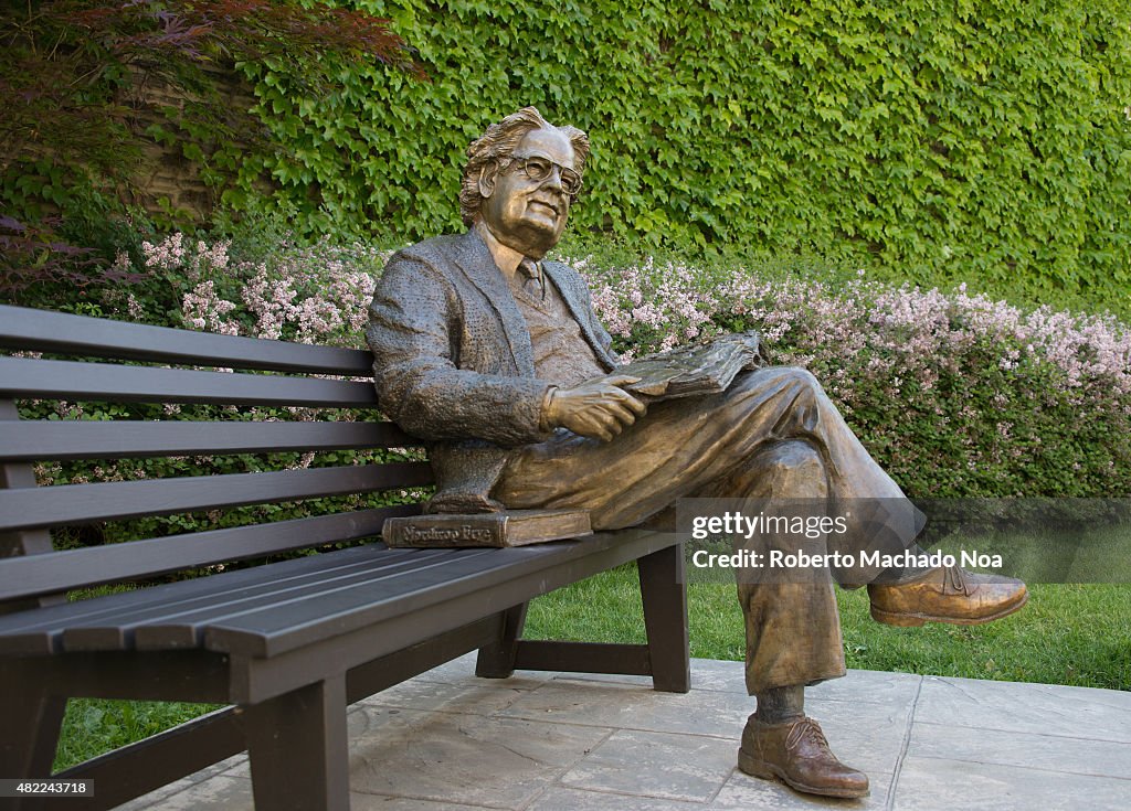 Statue of literary critic Northrop Frye on a park bench at...