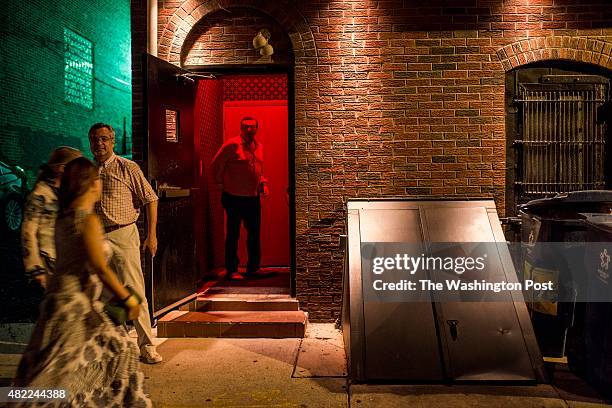 Via an alley customers enter a hidden speakeasy, The Ranstead Room, on Friday evening in Philadelphia, Pennsylvania, July 10th, 2015.