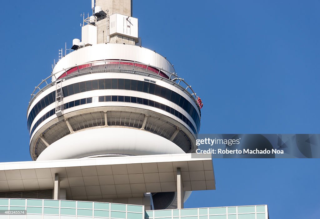 Close up of main pod of Toronto CN Tower with people...