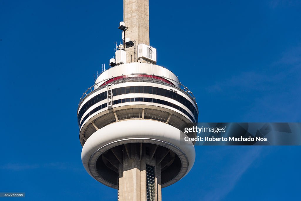 Close up of main pod of Toronto CN Tower against clear blue...