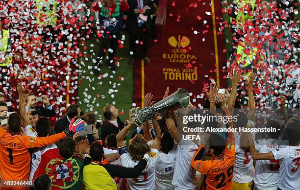 The Sevilla FC team celebrate as Captain, Ivan Rakitic of Sevilla FC lifts the trophy after victory during the UEFA Europa League Final between...